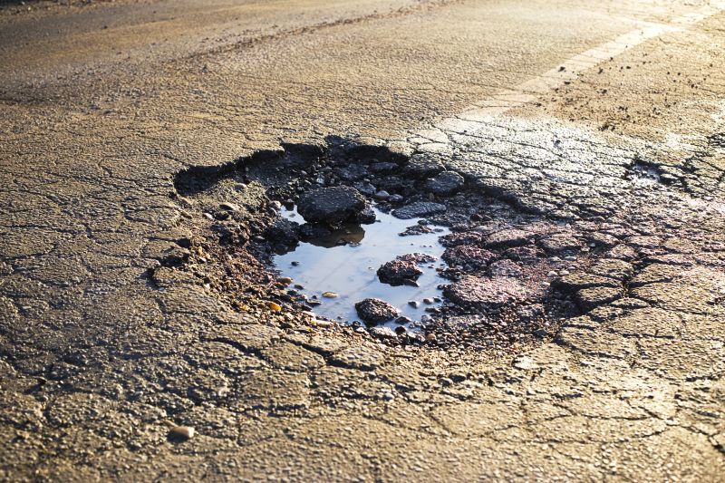 How Weather Conditions Affect Asphalt Cracks And Potholes